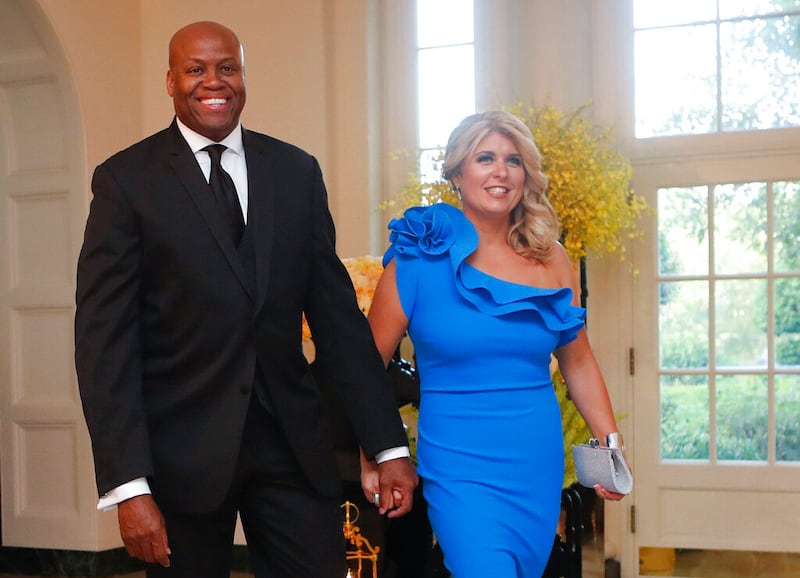 Craig Robinson, brother of former first lady Michelle Obama, and his wife, Kelly Robinson, arrive for a state dinner.