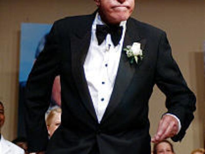 Dick Van Dyke clowns around on stage at Danville (Ill.) High School.