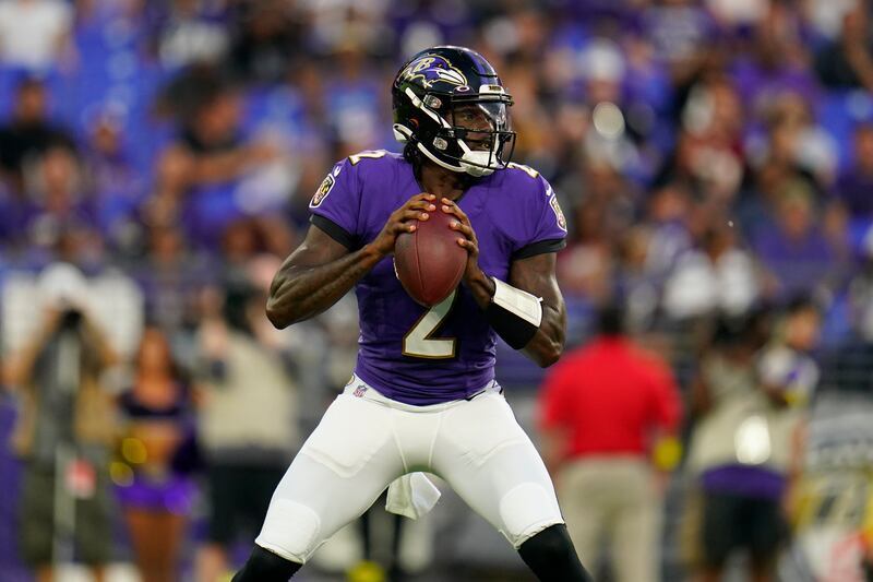 Baltimore Ravens quarterback Tyler Huntley looks for a receiver in the first half of a preseason NFL football game against the Washington Commanders, Saturday, Aug. 27, 2022, in Baltimore. (AP Photo/Julio Cortez)