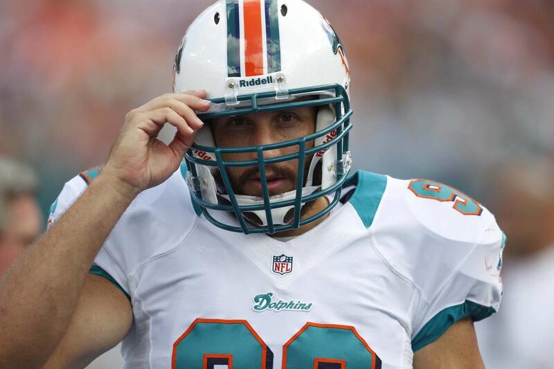 Miami Dolphins long snapper John Denney (92) during the first half of an NFL football game against the New England Patriots, Sunday, Dec. 2, 2012, in Miami.