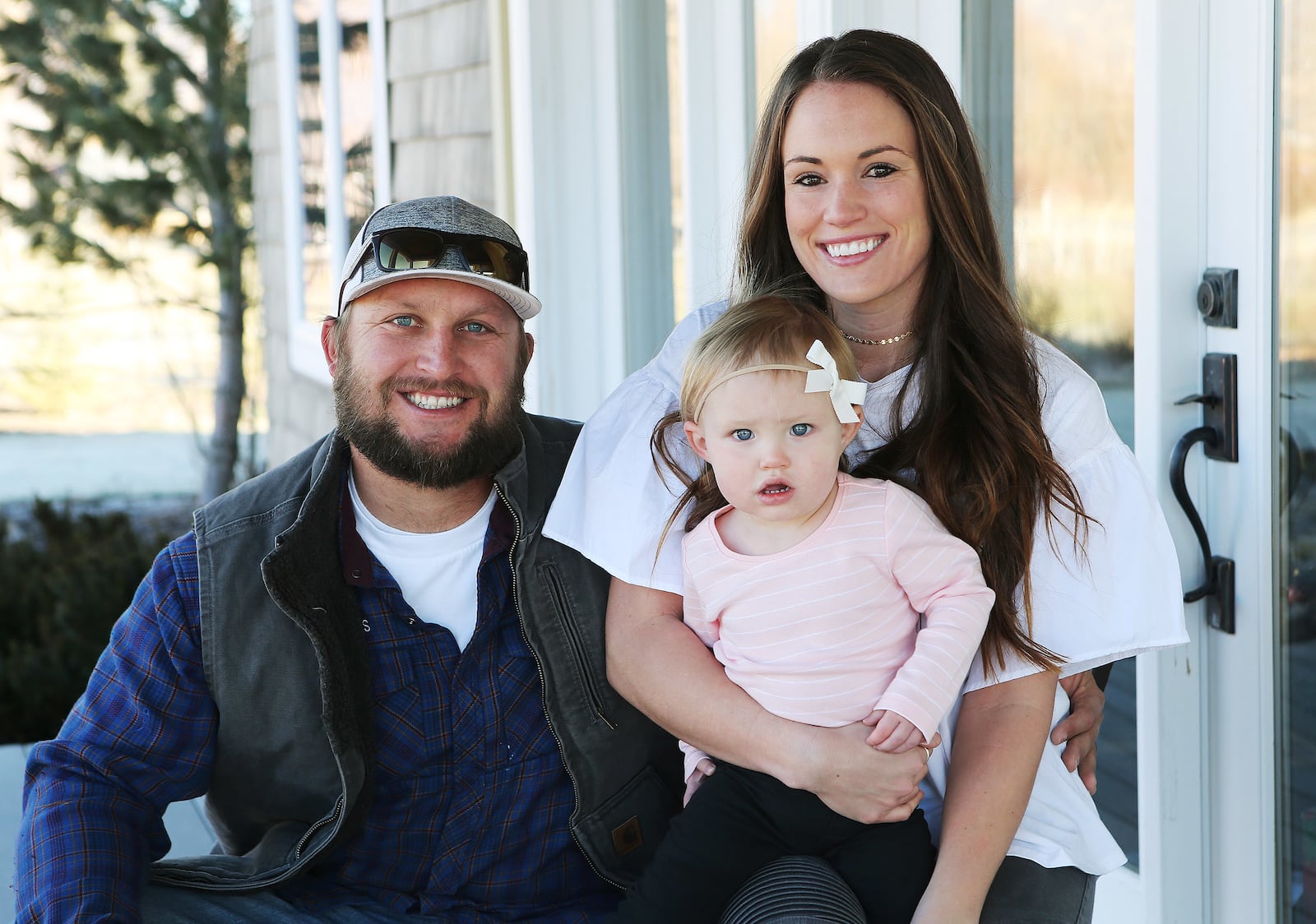 Jesse and Ashly Stone hold their daughter, Jane, near their home in Heber on Nov. 29, 2017. Both struggled with opioid addiction and have been clean for five years.