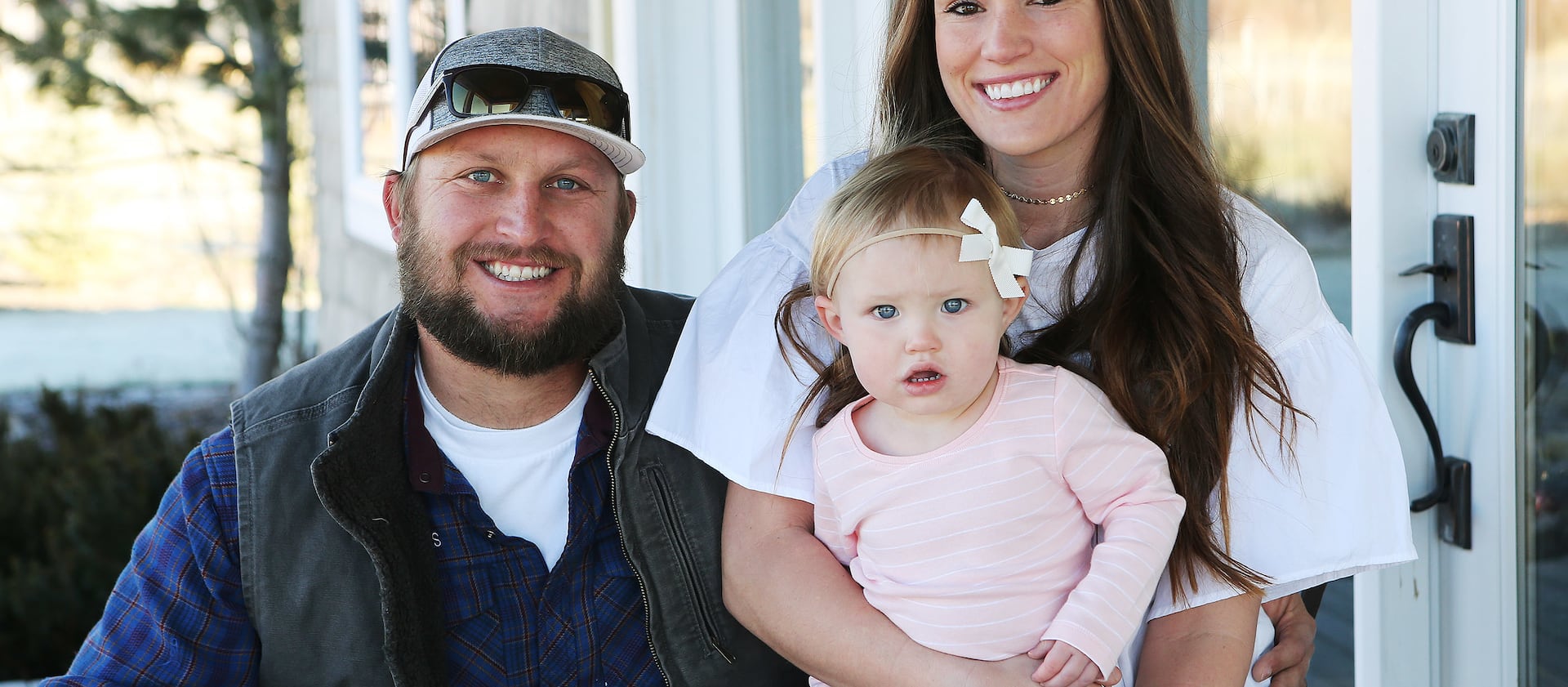 Jesse and Ashly Stone hold their daughter, Jane, near their home in Heber on Nov. 29, 2017. Both struggled with opioid addiction and have been clean for five years.