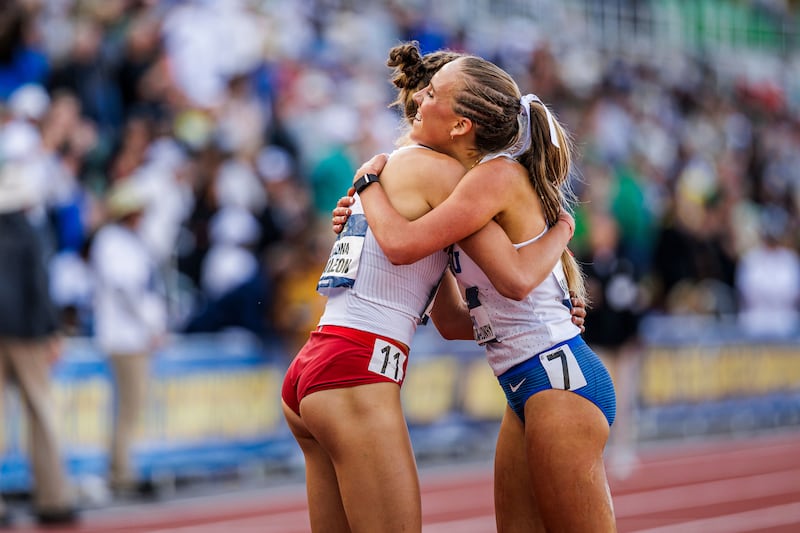 BYU's Lexi Lowry hugs a competitor after placing second in the women's steeplechase at the NCAA track and field championships in Eugene, Oregon, June 14, 2025.