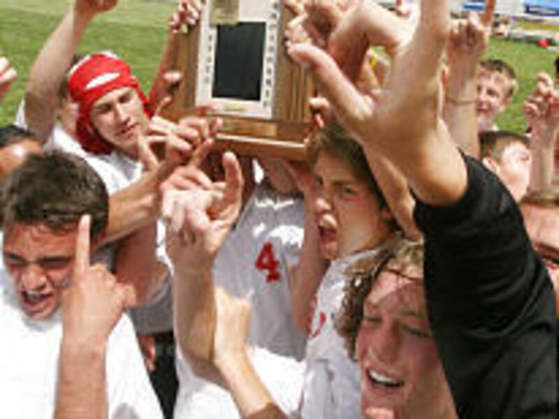 The Park City boys soccer players celebrate after blanking Logan to win the 3A soccer title Saturday.