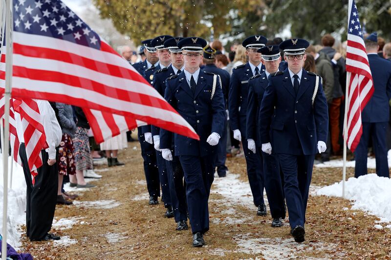 Members of the BYU and Utah Valley University Air Force ROTC leave after folding an American flag during graveside services for Col. Gail S. Halvorsen.