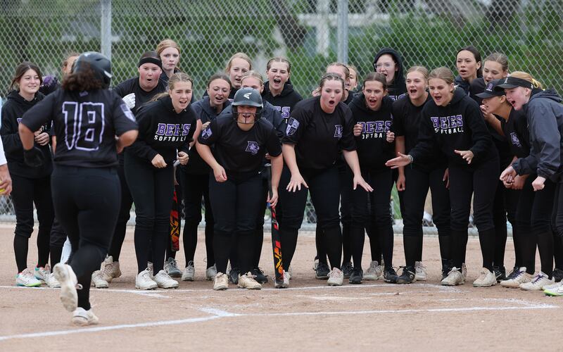 Box Elder celebrates Malena Benson’s (wearing black) home run