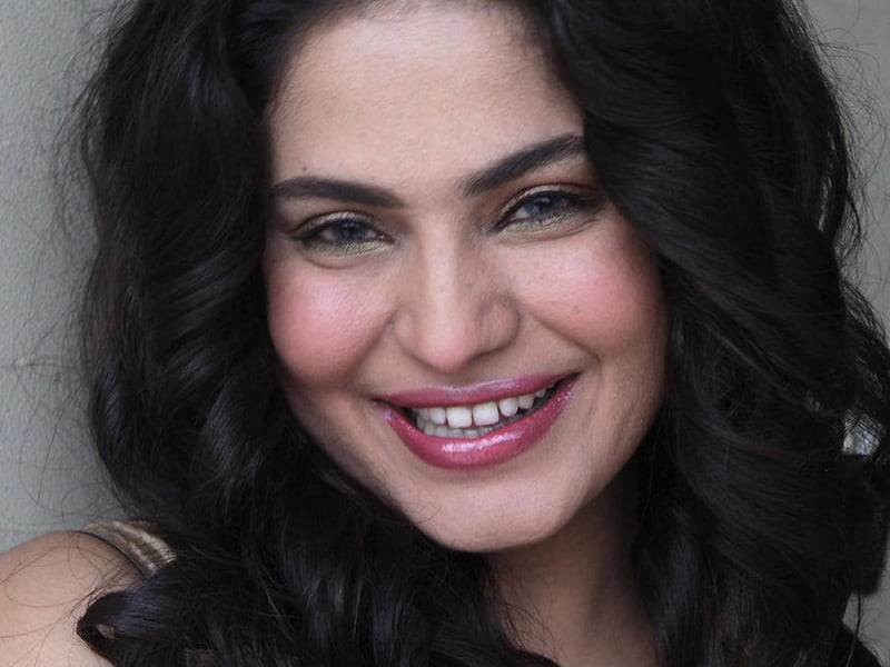 FILE - In this Sept. 4, 2010 file photo, Pakistani Actress Veena Malik is seen at her residence in Lahore, Pakistan. Malik castigated for appearing to cuddle with an Indian actor on a reality show lashed out Saturday Jan. 22, 2011 at a Muslim cleric who h