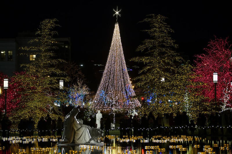 People tour the Christmas lights near Temple Square in Salt Lake City on Friday, Nov. 25, 2016.