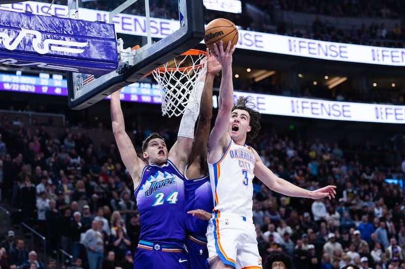Oklahoma City Thunder guard Josh Giddey attempts a layup against Jazz center Walker Kessler during game at Vivint Arena.