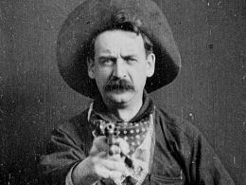 Actor George Barnes points his pistol in a scene from the 1903 silent movie "The Great Train Robbery."