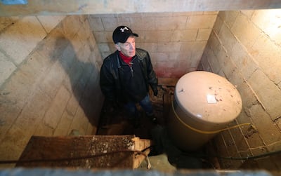Steve Andersen stands in the dried up water well at his home in Emigration Canyon on Friday, Dec. 28, 2018. The creek is also dry at his home.