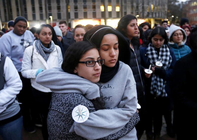 N.C. State sophomore Firdaws Chahrour, right, hugs Danyah Dahbour before a vigil on the N.C. State campus for Deah Shaddy Barakat, 23, his wife Yusor Mohammad Abu-Salha, 21, and Abu-Salha's sister, Razan Mohammad Abu-Salha, 19, Thursday, Feb. 12, 2015. T