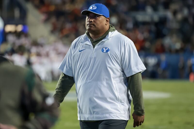 BYU coach Kalani Sitake walks off the field at halftime with the Cougars trailing Iowa State 31-7 at LaVell Edwards Stadium.