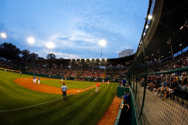 The sun sets on Lamade Stadium during a baseball game at the Little League World Series in 2017.