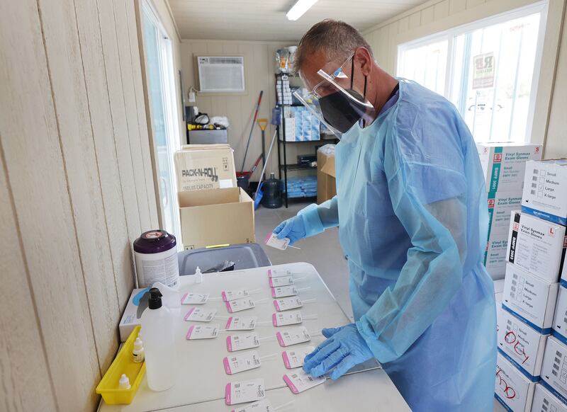 COVID-19 tests are processed at the Mount Olympus Senior Center parking lot in Millcreek on Tuesday, Oct. 5, 2021.