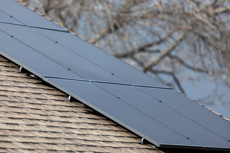 Solar panels are seen on a rooftop in Salt Lake City, on Thursday, Feb. 8, 2024.