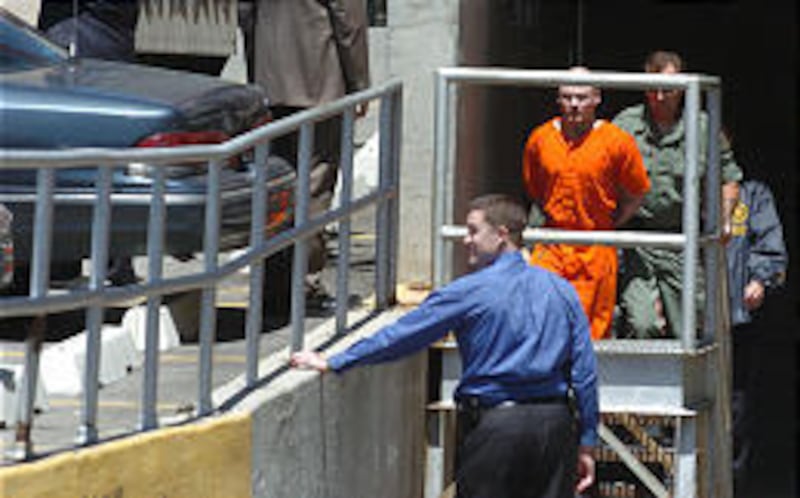 Lance Vanderstappen, accused of stabbing a fellow inmate with a smuggled shank, is escorted by officers at the federal courthouse.
