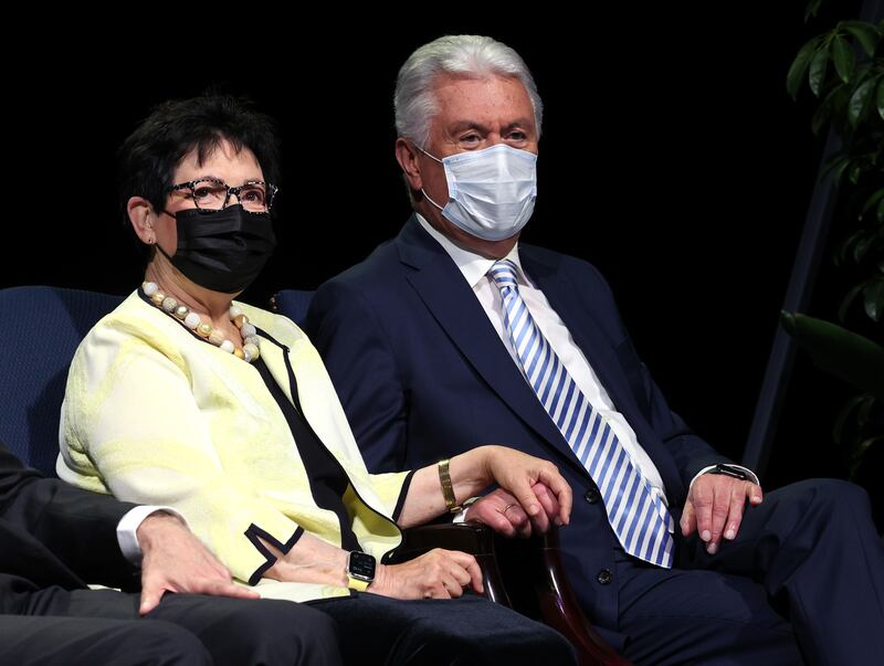 Sister Harriet Uchtdorf and Elder Dieter F. Uchtdorf hold hands prior to speaking at BYU Education week.