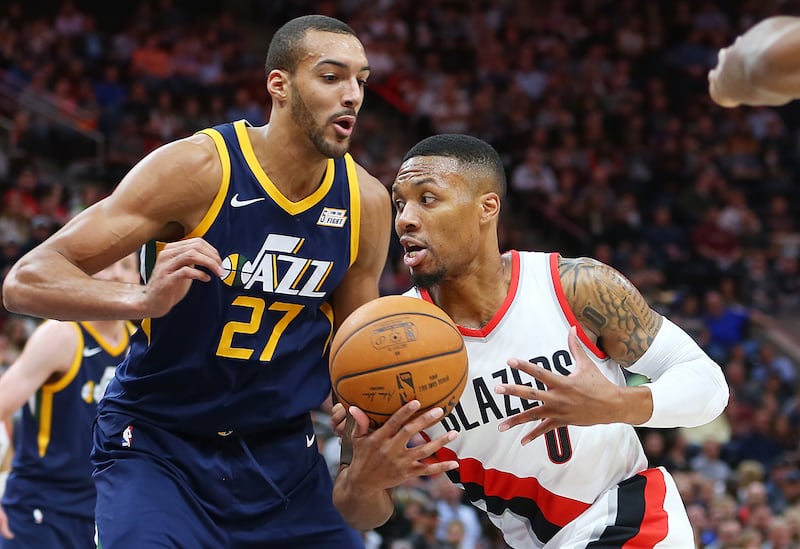 Utah Jazz center Rudy Gobert (27) defends Portland Trail Blazers guard Damian Lillard (0) as the Utah Jazz and the Portland Trailblazers play at Vivint Arena in Salt Lake City on Wednesday, Nov. 1, 2017.