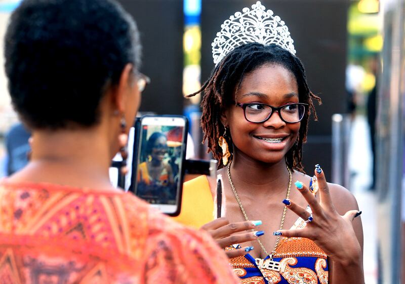 Juneteenth Queen Angel Marshall talks with friends as they attend a Juneteenth festival at the Gallivan Center in Salt Lake City on Wednesday, June 19, 2019. As Utah's population becomes increasingly diverse, those who are biracial and multiracial are fue
