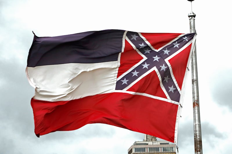 The old Mississippi state flag flies outside the Capitol in Jackson, Miss. Mississippi, June 25, 2020.