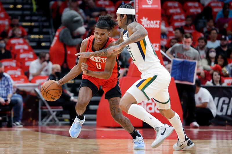 Houston Rockets guard Jalen Green drives under pressure from Utah Jazz guard Jordan Clarkson