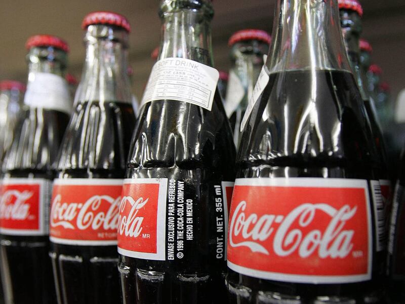 In this Nov. 3, 2004 file photo, bottles of Mexican Coca-Cola fill a prominent spot on the shelves of the Tarascas Latino Supermarket in Lawrenceville, Ga. Americans who buy the glass bottles of Coke exported from Mexico may have been dismayed by recent o