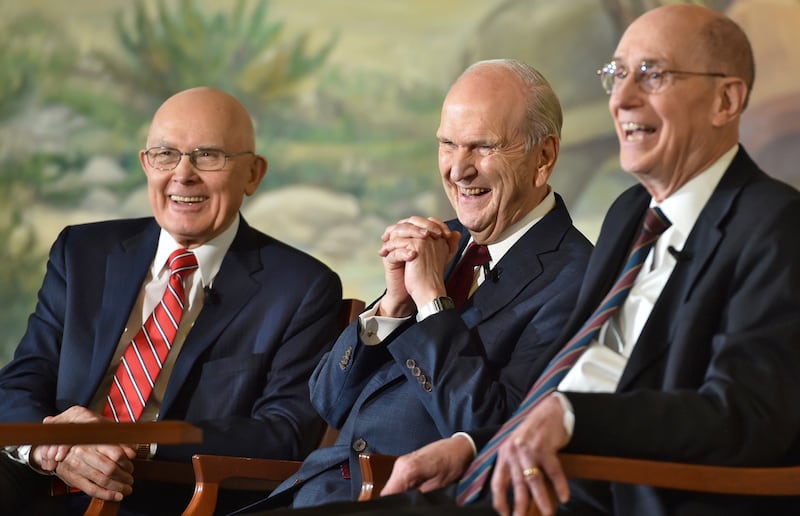 President Russell M. Nelson, sits with his counselors, President Dallin H. Oaks, first counselor, left, and President Henry B. Eyring, second counselor, right, at a press conference in Salt Lake City.