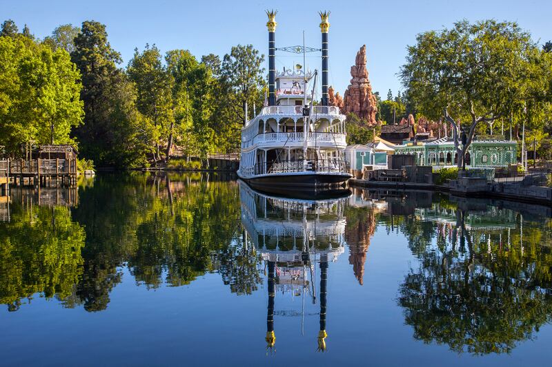 The Mark Twain Riverboat and Big Thunder Mountain are reflected in the Rivers of America in Frontierland at Disneyland Park in Anaheim, Calif. Frontierland brings to life the natural beauty, excitement and promise of the American West in the 1800s. For editorial news use only.