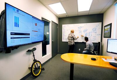 Ryan Wedig, right, and Corey Ercanbrack talk at PrinterLogic in St. George on Wednesday, Jan. 17, 2018.