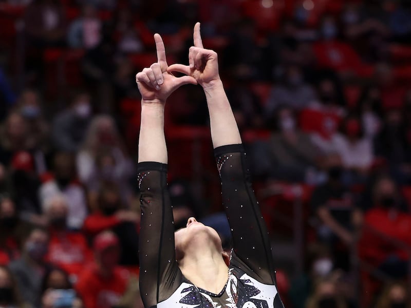 Utah’s Maile O’Keefe flashes a “U” during the gymnastics meet against Arizona State University at the Huntsman Center.