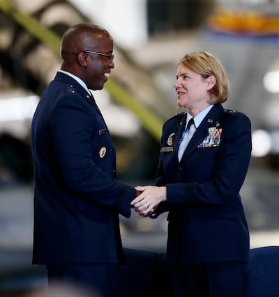 Maj. Gen. Stacey T. Hawkins and Brig. Gen. C. McCauley von Hoffman shake hands as von Hoffman takes command of the Ogden Air Logistics Complex from Hawkins during a ceremony at Hill Air Force Base near Ogden on Friday, July 19, 2019.