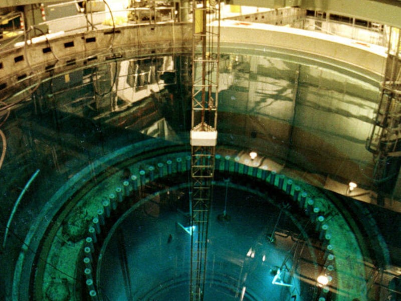 FILE - In this December 1985 file photo, workers refuel the core of the Vermont Yankee nuclear power plant in Vernon, Vt. The owner of Vermont's only nuclear power plant plans to move forward with a $60 million refueling this fall despite uncertainty abou