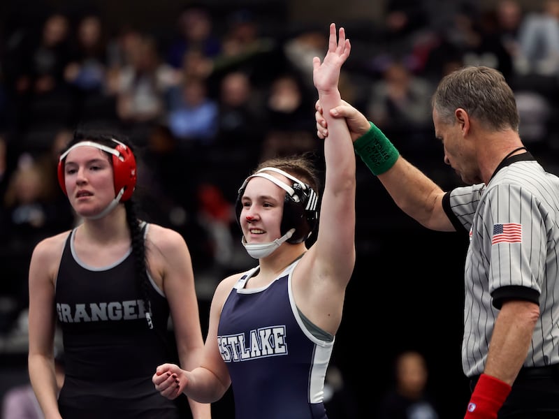 Westlake’s Ashley Cannon celebrates a victory against Granger’s Kimberly Chaparro in the 6A wrestling championships at the UCCU Center in Orem on Thursday, Feb. 16, 2023.