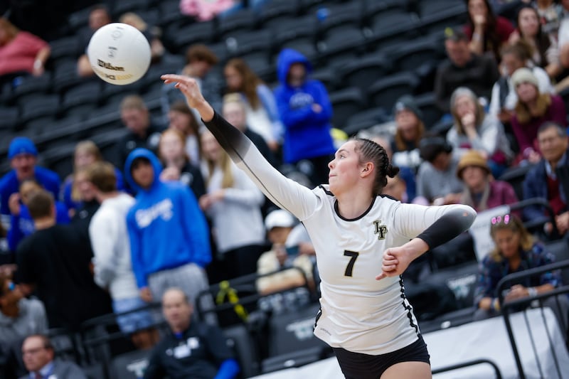 Lone Peak Knights’ Zoey Burgess, wearing white, hits the ball