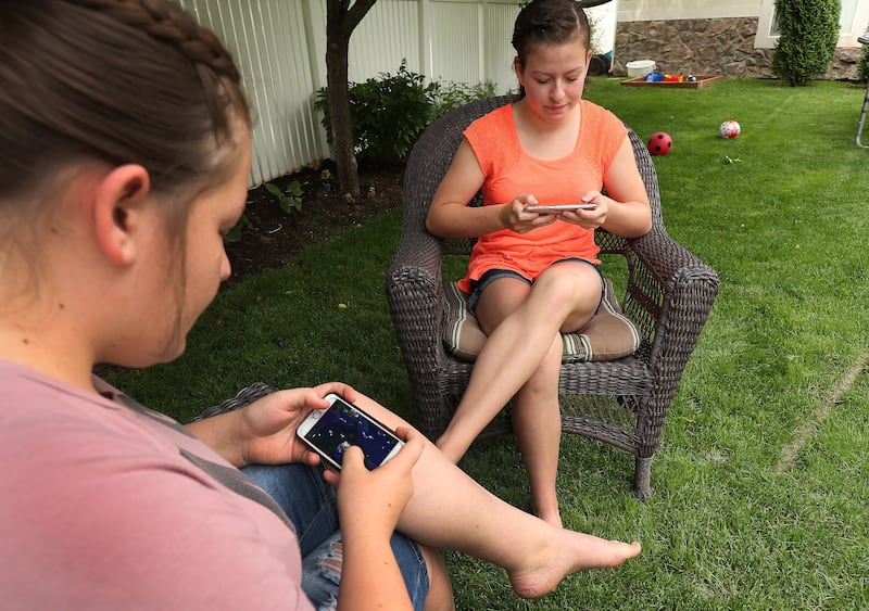 Morgan Selleneit, right, plays Fornite with her friend Macee Silvester at her home in Centerville on Thursday, May 31, 2018. Morgan is 15 and uses her phone around 3 hours a day, mostly on Instagram and Snapchat.