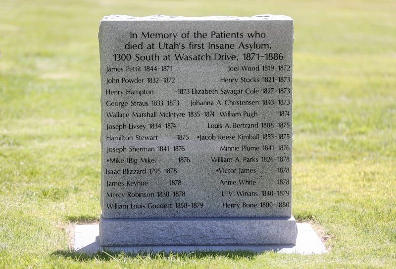 A new granite marker memorializing those who died in the state’s first insane asylum is pictured following a dedication ceremony at the Salt Lake City Cemetery on Tuesday, July 2, 2019.