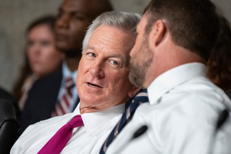 Sen. Tommy Tuberville, R-Ala., left, speaks with Sen. Markwayne Mullin, R-Okla., during a Senate Armed Services Committee nominations hearing on Sept. 12, 2023.