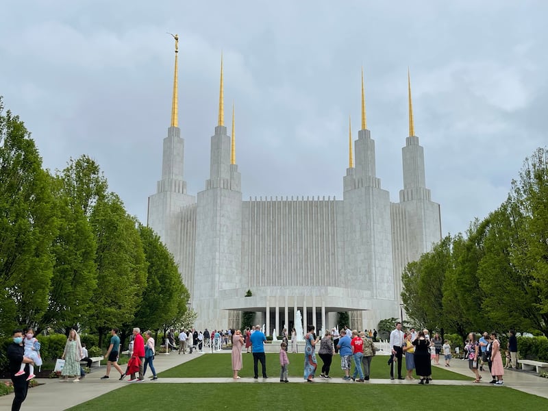 Washington D.C. Temple open house visitors take photos on the mall in front of the temple in Kensington, Maryland, on May 27, 2022.