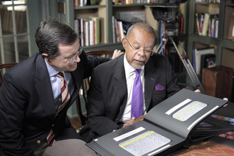 Stephen Colbert, left, learns about his family history from Henry Louis Gates Jr.