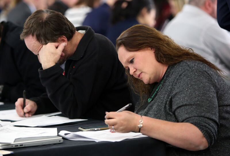 Mindy Sipes fills out an application for expungement on “Expungement Day” at St. Vincent de Paul Dining Hall in Salt Lake City on April 5, 2018.