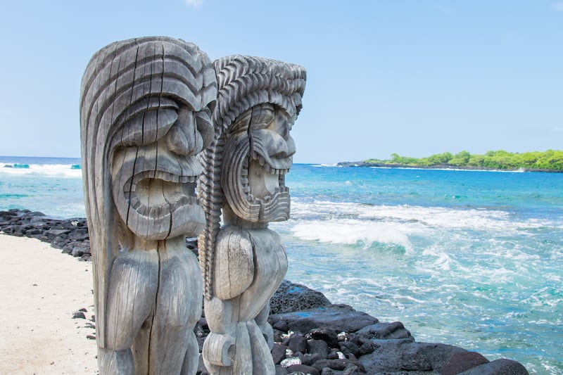 Traditional Hawaiian wood carving of guards are at Pu'uhonua O Honaunau National Historical Park on Big Island, Hawaii.