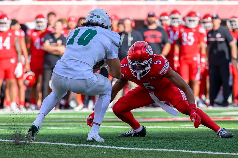 Utah safety Tao Johnson (5) squares up to tackle Cal Poly wide receiver Michael Briscoe (10) during a game Saturday, Sept. 6, 2025, in Salt Lake City, Utah.