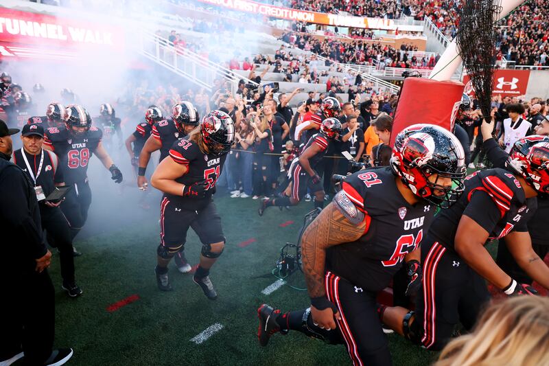 Utah players run out onto the field as they prepare to play USC at Rice-Eccles Stadium in Salt Lake CIty on Saturday, Oct. 15, 2022.