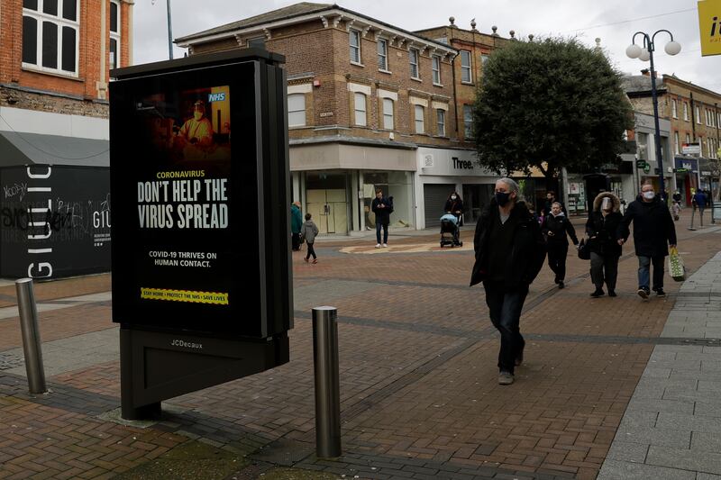 A coronavirus information sign is displayed in Kingston upon Thames, south west, London, Tuesday, Jan. 19, 2021, during England’s third national lockdown since the coronavirus outbreak began.