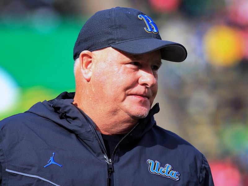 UCLA coach Chip Kelly watches warmups before a game against Oregon Saturday, Oct. 22, 2022, in Eugene, Ore.