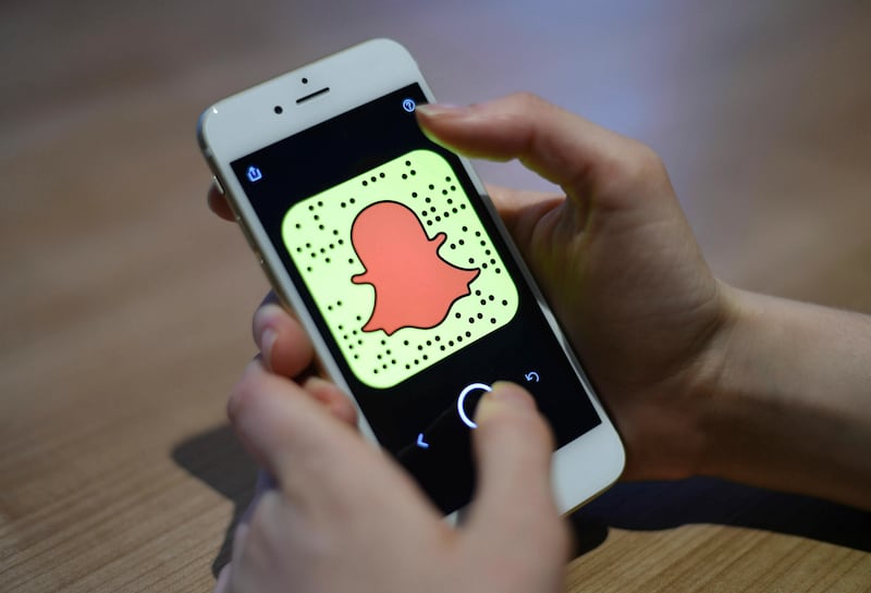 This file photo dated March 3, 2017, shows the Snapchat app on a mobile phone. Snapchat has been accused of being “wholly irresponsible” for allowing accounts allegedly promoting explicit images of teenagers to be searchable on its app.