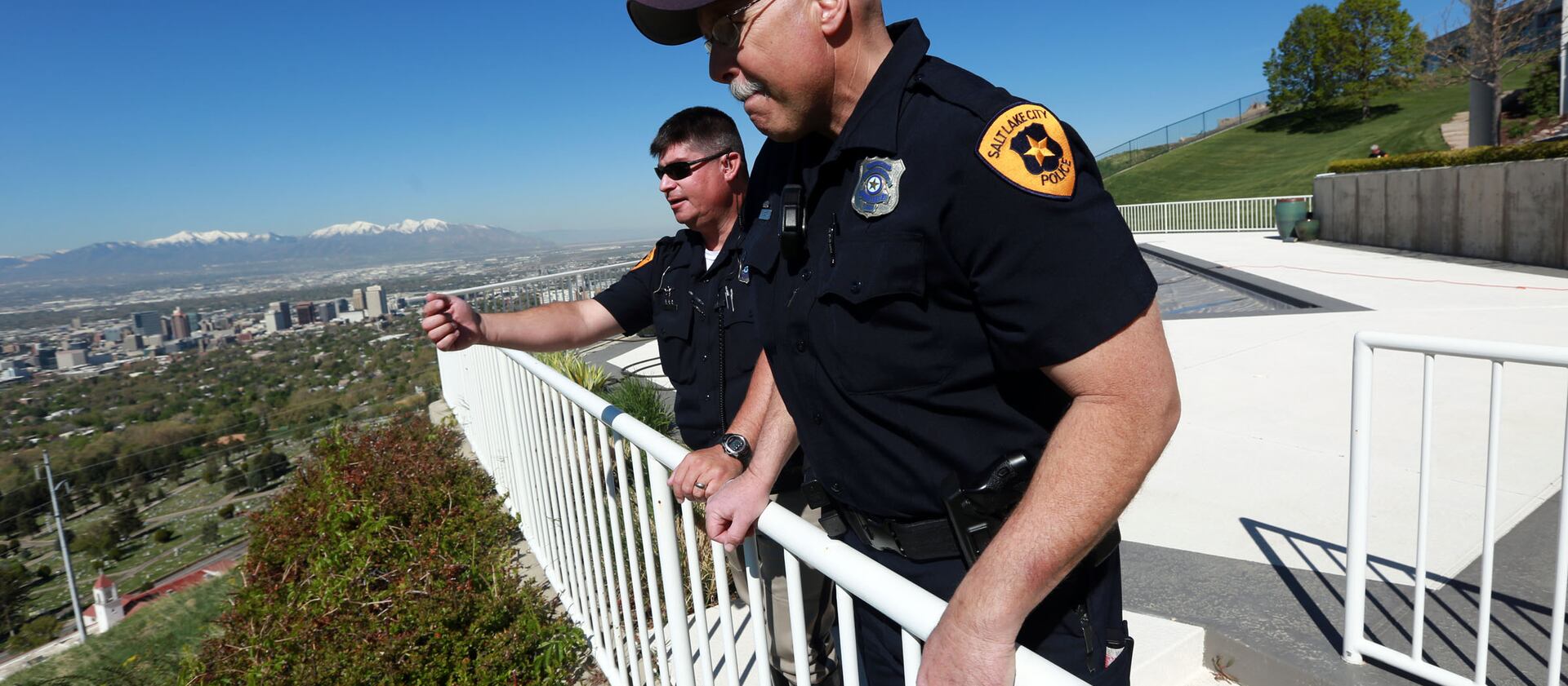 Salt Lake City Police officers look at the area where a boy who has autism spent the night. A new Utah law requires new officers to complete training about autism and mental illness.
