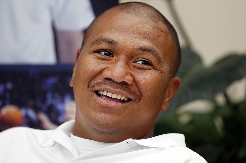 Running backs coach Mark Atuaia is interviewed during BYU Football Media Day in Provo, Monday, June 23, 2014.