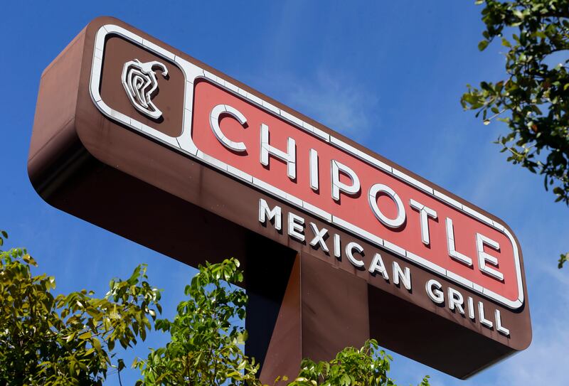 FILE - This Monday, Feb. 8, 2016, file photo shows the sign at a Chipotle restaurant. A state health official says a second person has tested positive for norovirus after eating at a Chipotle in Sterling, Va., before it was temporarily closed on Monday, J